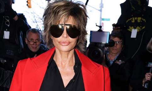Lisa Rinna, 59, shows off her legs in a revealing playsuit with a deep neckline